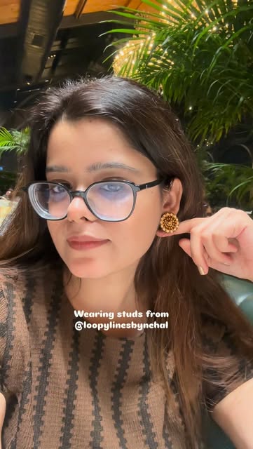 Nehal wearing studs from her own mandala jewellery collection
